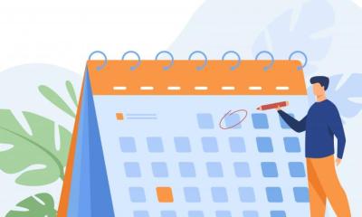 Geschäftsmann plant Termine - großer Kalender